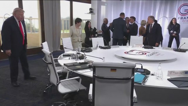 German Chancellor Friedrich Merz handed President Trump a soccer jersey for his birthday at the G7 summit