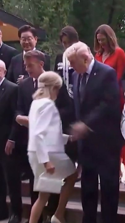 Trump saves Brigitte Macron from tumble during G7 photo