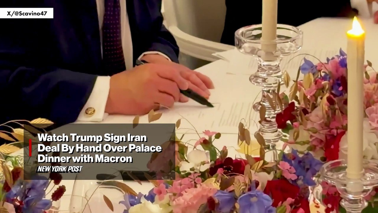 Watch Trump sign Iran deal by hand over palace dinner with Macron