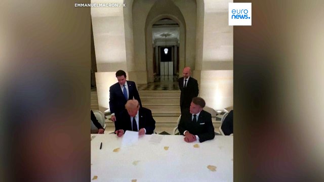 Moment Trump signs US-Iran deal at Palace of Versailles