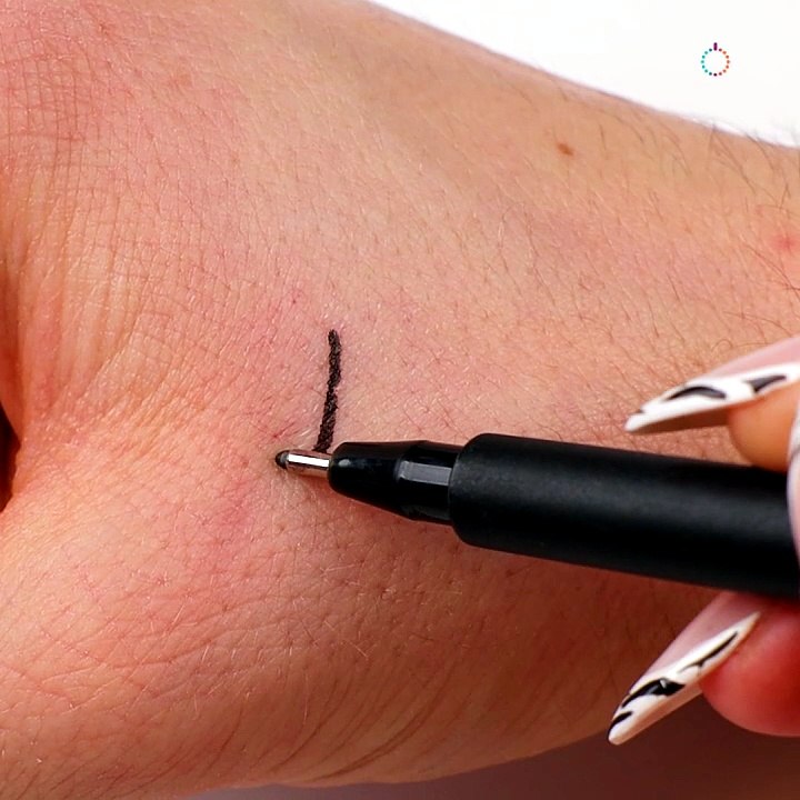 Try this simple initial tattoo art at home