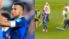 Mbappé takes charge as France players battle flooded field