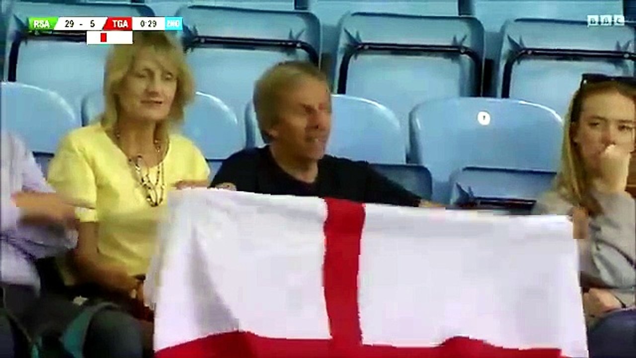 Woman in crowd shakes booty during Rugby sevens at the Commonwealth Games