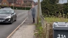 Strong Wind Snatches Panel From Man's Grip
