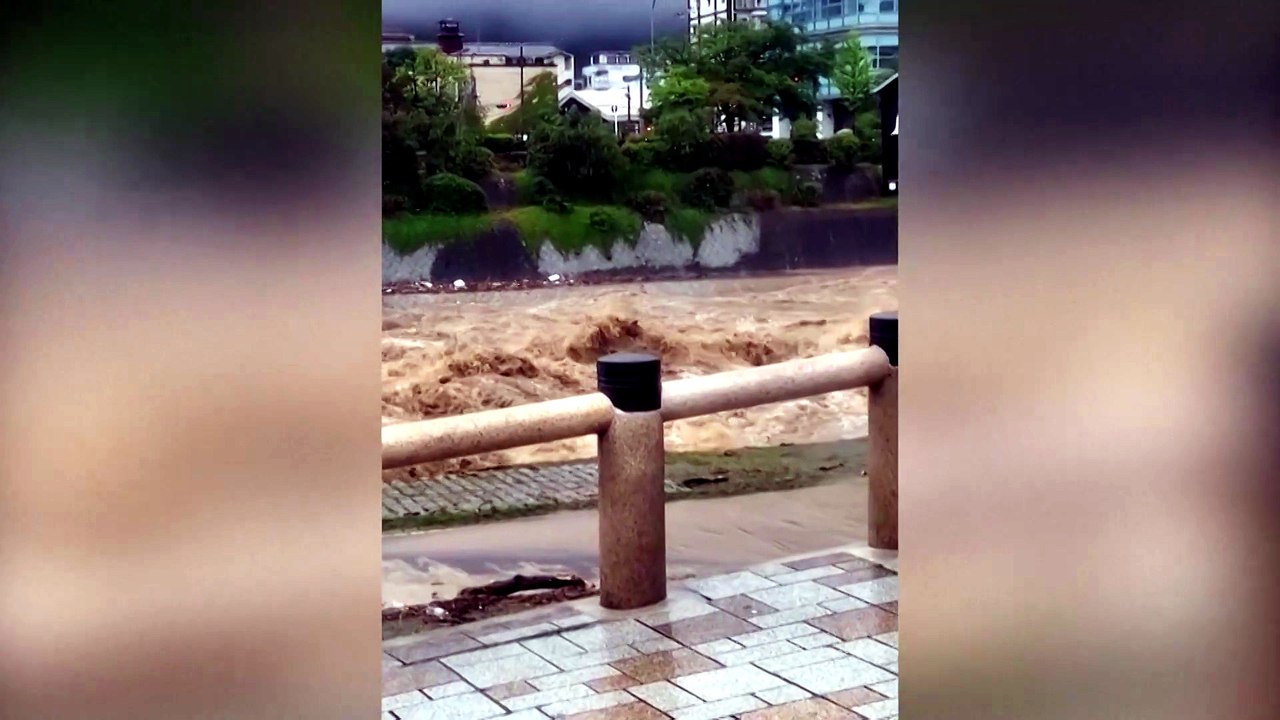 Kyoto's Kamo River surges with muddy torrent after heavy rainfall