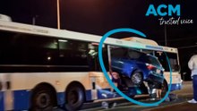 Airborne car plows into side of a bus in Brisbane