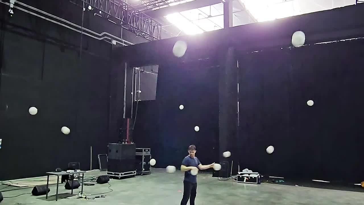 Man Performs Horizontal Juggling Tricks