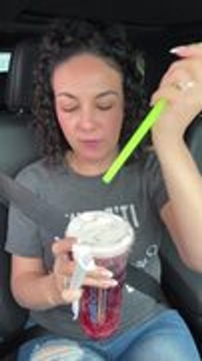 Drink Spills as Woman Puts Straw Through Lid