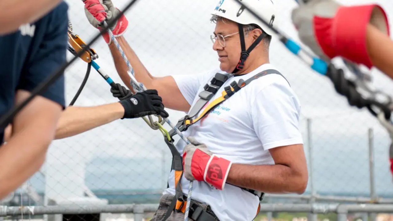 Heart attack survivor returns to St Helier Hospital to complete charity abseil