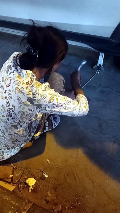 girl fixing the car tire