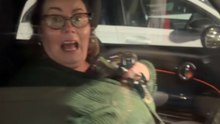 Girl Stares Through Car Window And Scares Her Sister