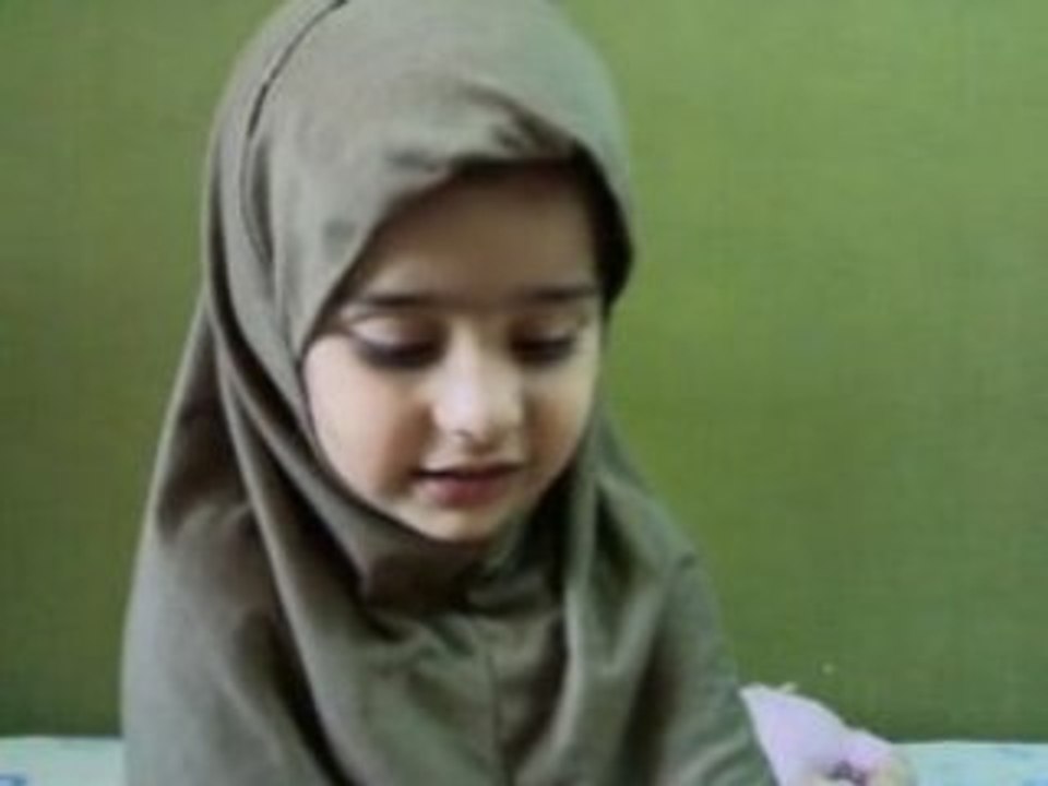 A girl reads Quran