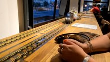 Mini train brings chaos to a dining experience with smashed drinks and shattered glasses