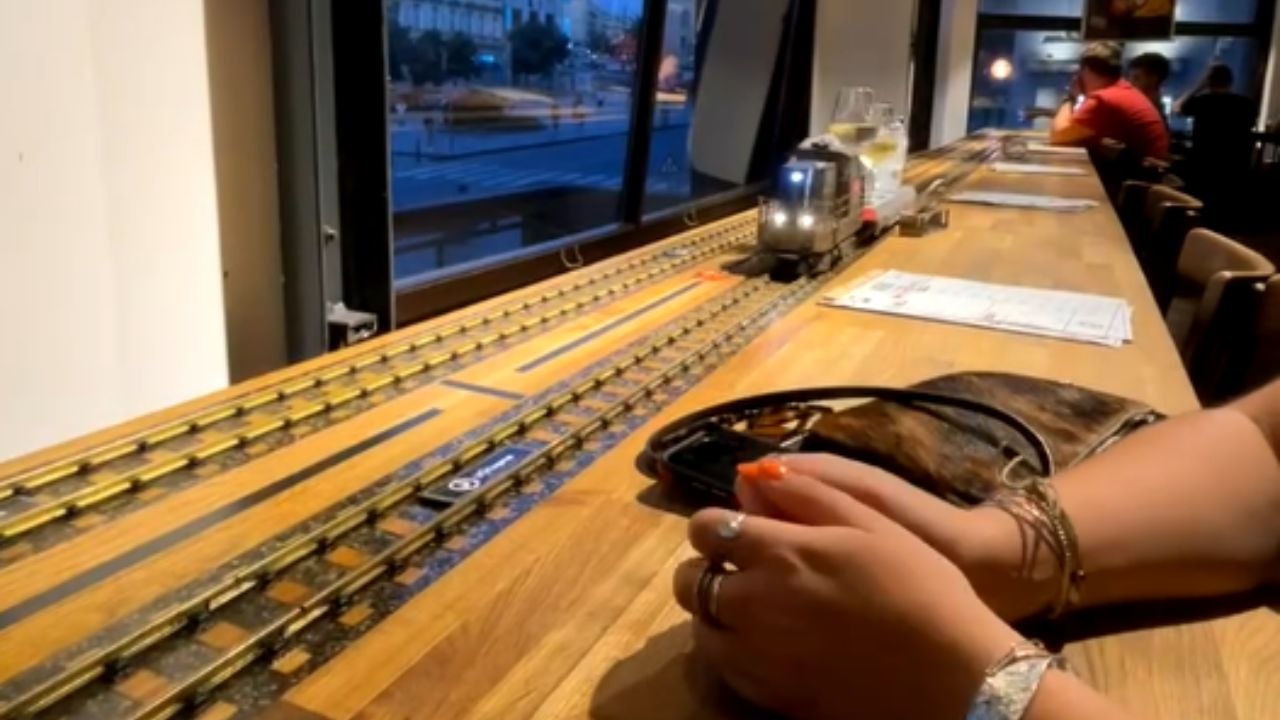 Mini train brings chaos to a dining experience with smashed drinks and shattered glasses