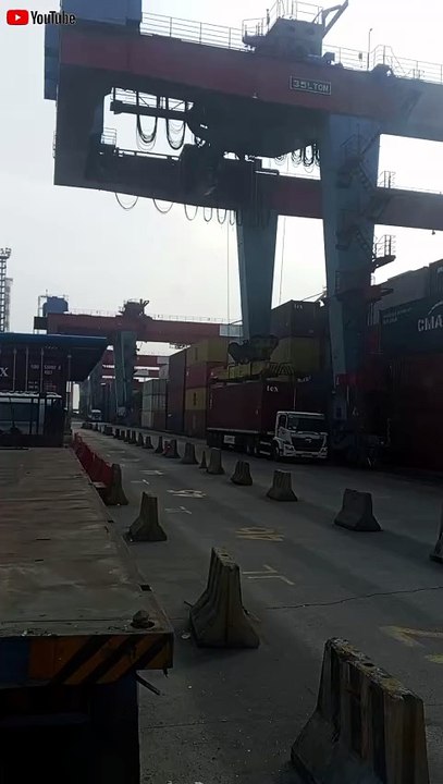 Hino tronton truck-trailer unloading an export container at Tanjung Priok Port