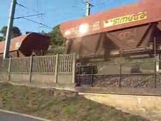 um de bb 69000 fret avec des wagons trémies