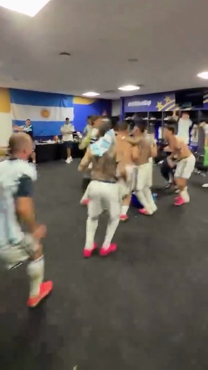 Argentina players celebrating in the locker room after beating Egypt in the World Cup