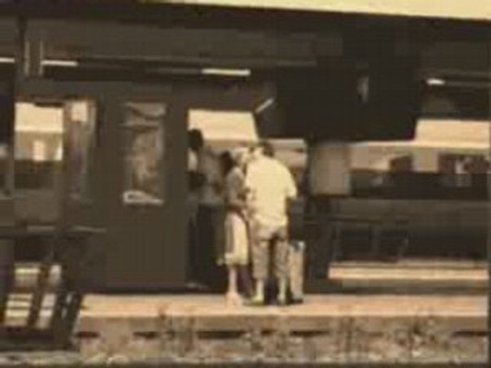 Two lovers parting on a platform