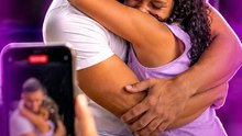 The daughter reacts with pure joy when her father appears behind her unexpectedly