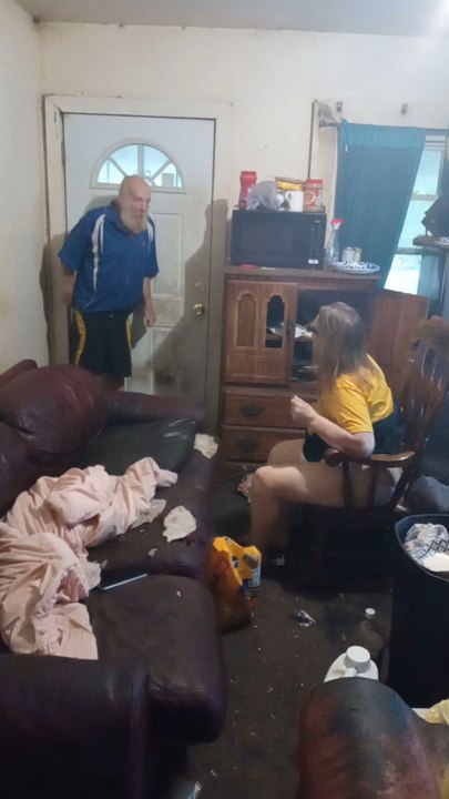 My mom attacking with my father with a  broom