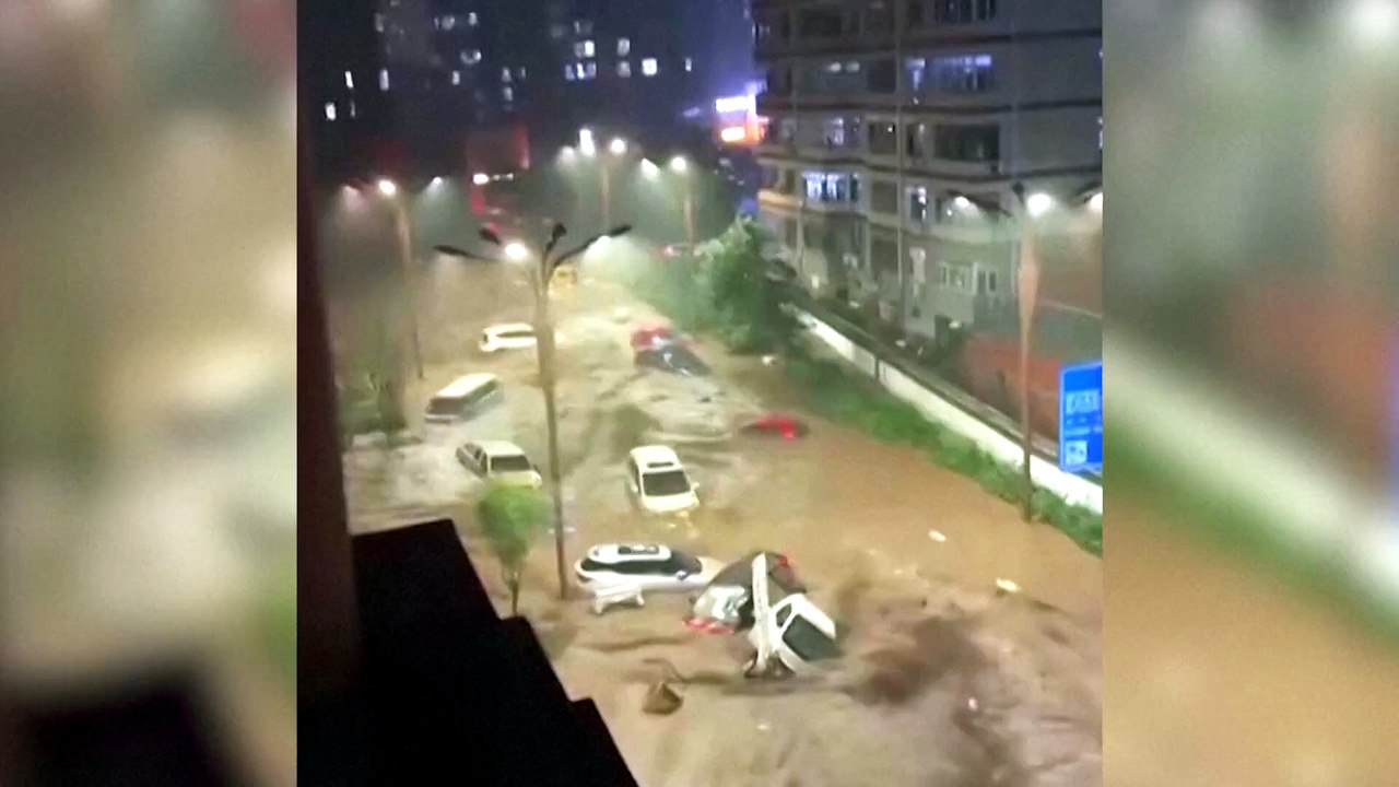 Floodwaters carry vehicles away in China's Chengde