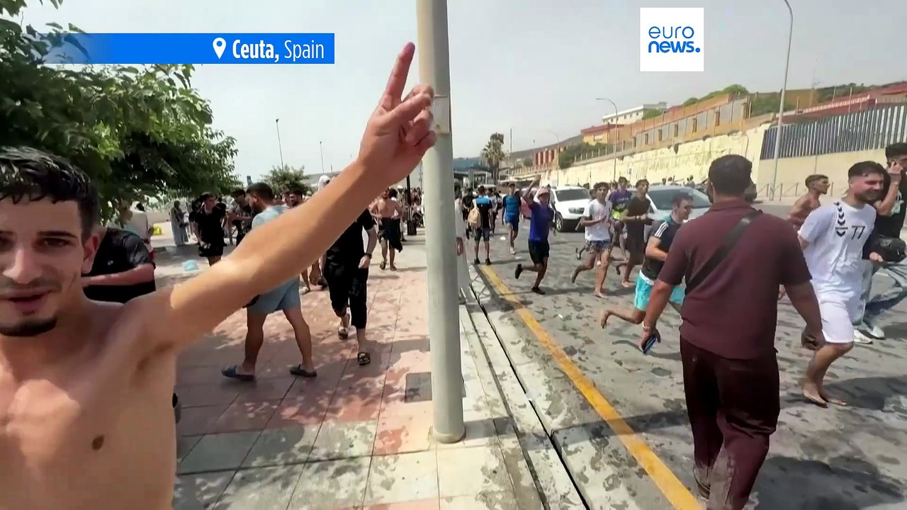 Spain mobilises troops to Ceuta as thousands of migrants continue to swim across the border from Morocco