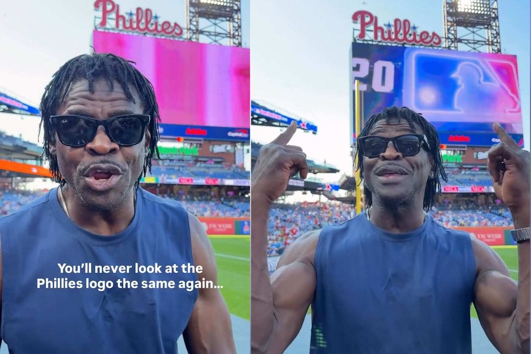 Michael Irvin se burla de los Eagles mientras se toma una foto con el letrero de los Phillies