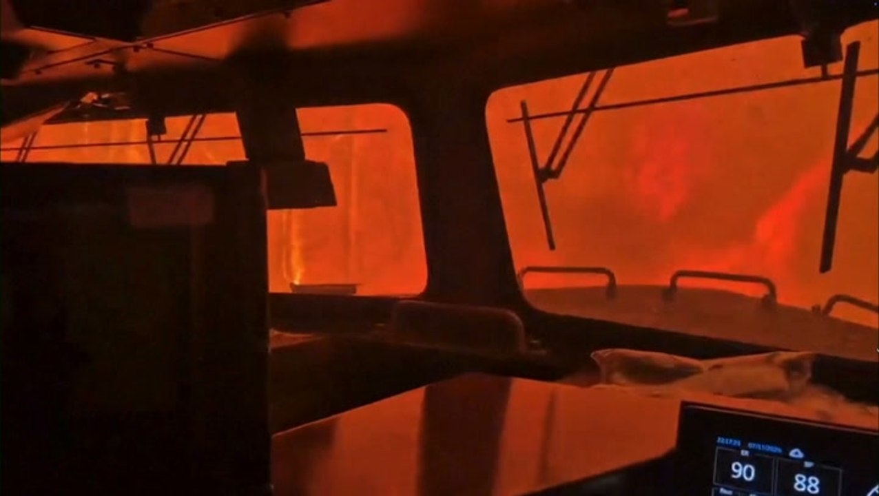 Intense flames surround train crew as wildfire rages in Canada