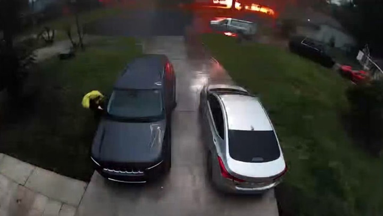 Lightning strike yards from woman exiting her car caught on doorbell camera