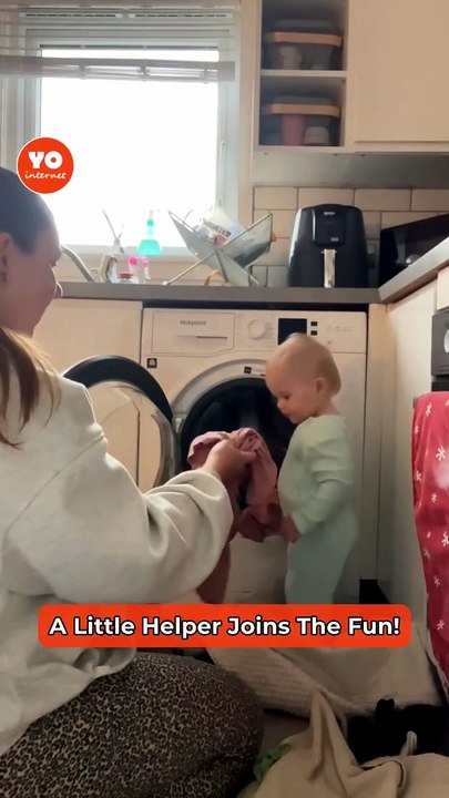 Young Girl Joyfully Assists Mom with Laundry Duties