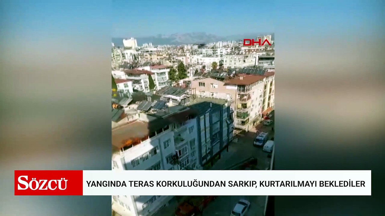 Yangında teras korkuluğundan sarkıp, kurtarılmayı beklediler