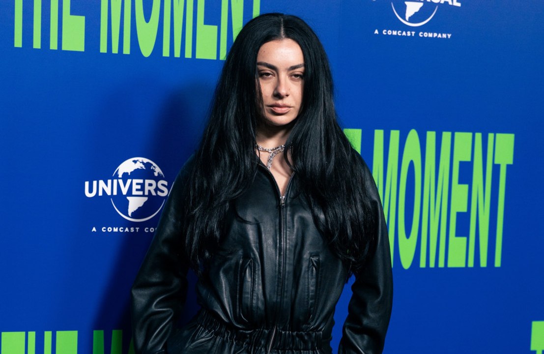 Charli XCX 's new album Music, Fashion, Film took her 'by surprise' because she was planning to take a break from music when inspiration struck