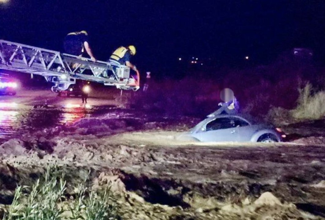 Daring rescue as firefighters pluck stranded driver from raging Arizona monsoon floods