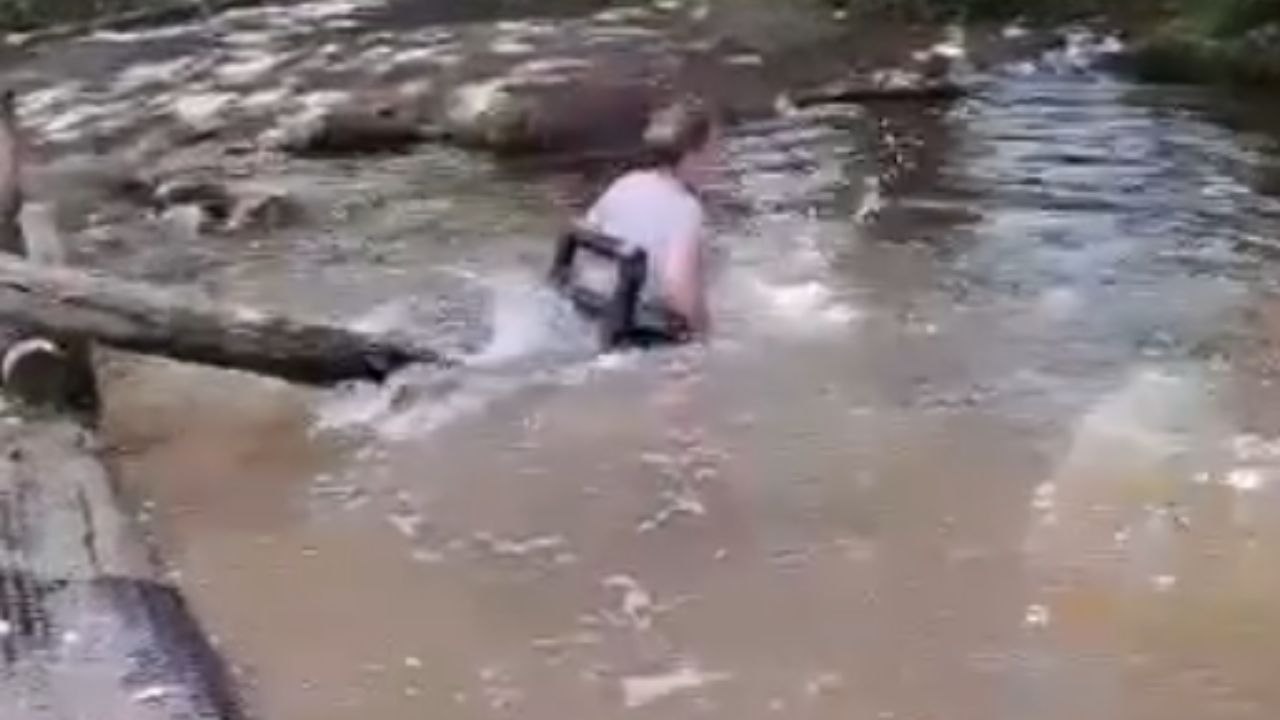Spinning seesaw ride turns 'SPLASHY' for fun-loving lady as she gets dunked in the water