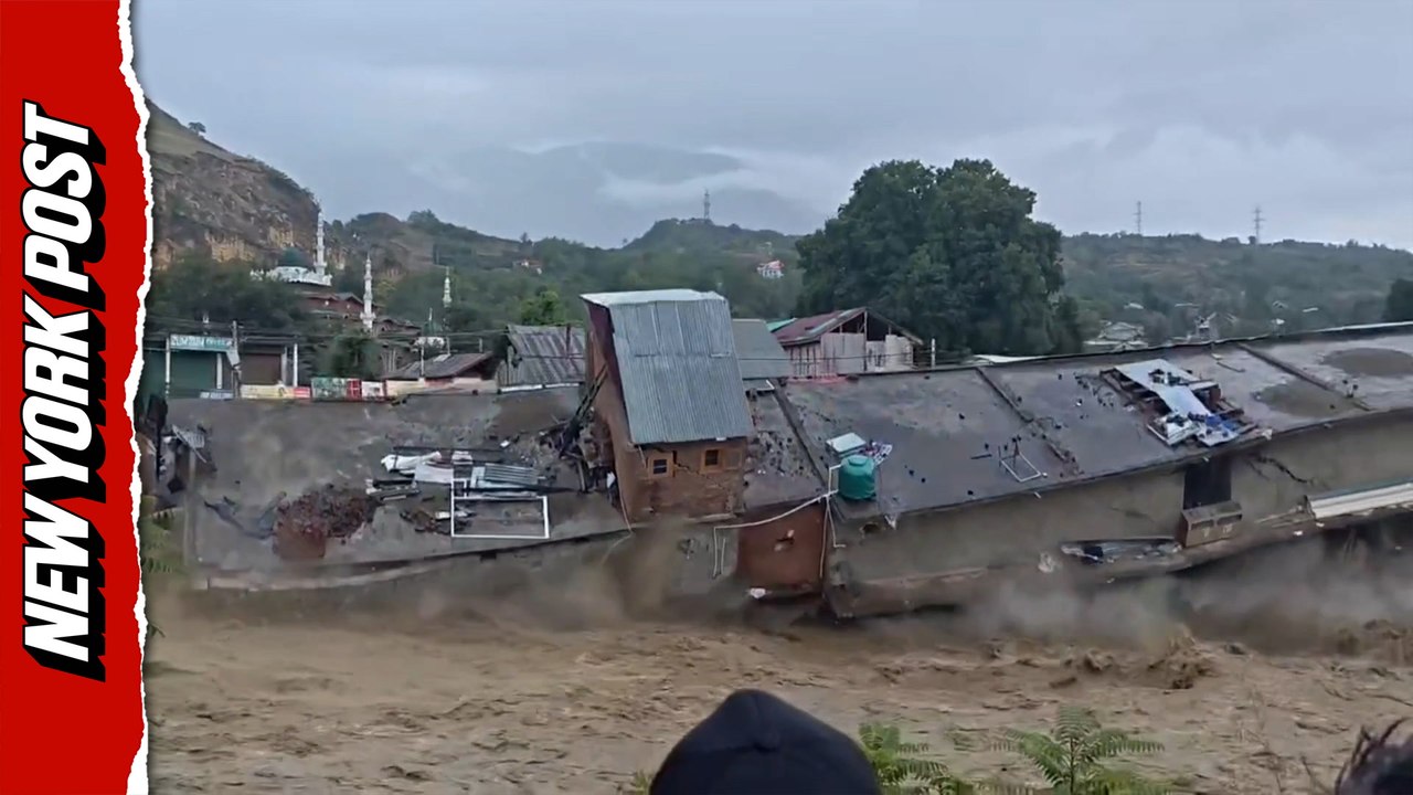 Terrifying moment buildings crash into river during deadly India floods