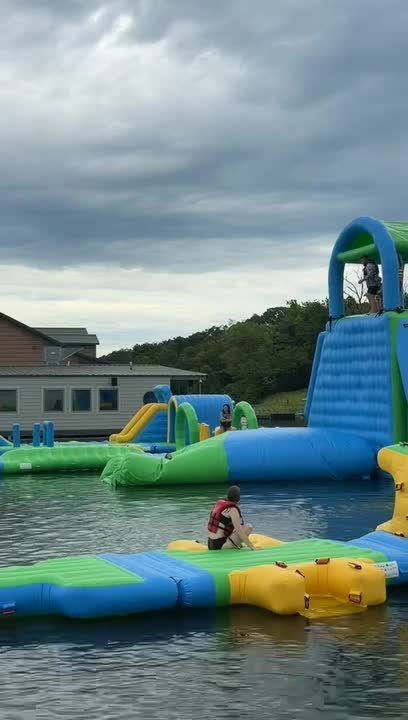 Dad Launches Daughter High up in Air off Water Blob but She Lands Awkwardly Into Water