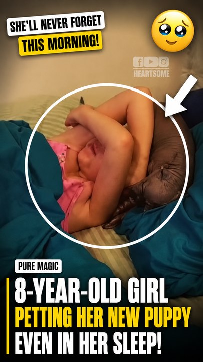 The little girl reacts with pure joy when she wakes up to a hairless puppy