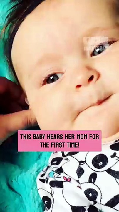The baby girl reacts with pure joy when hearing aids let her hear her mother