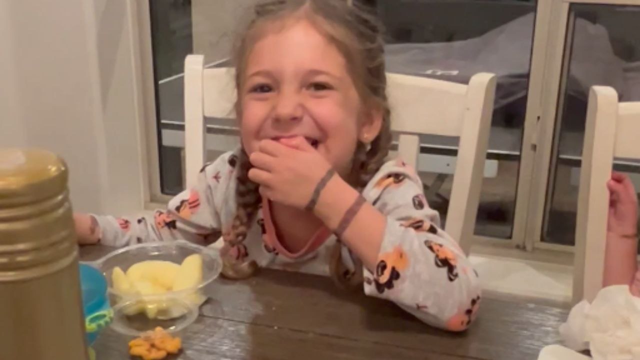 Young Girl Repeats School Prayer Joyfully at Dinner