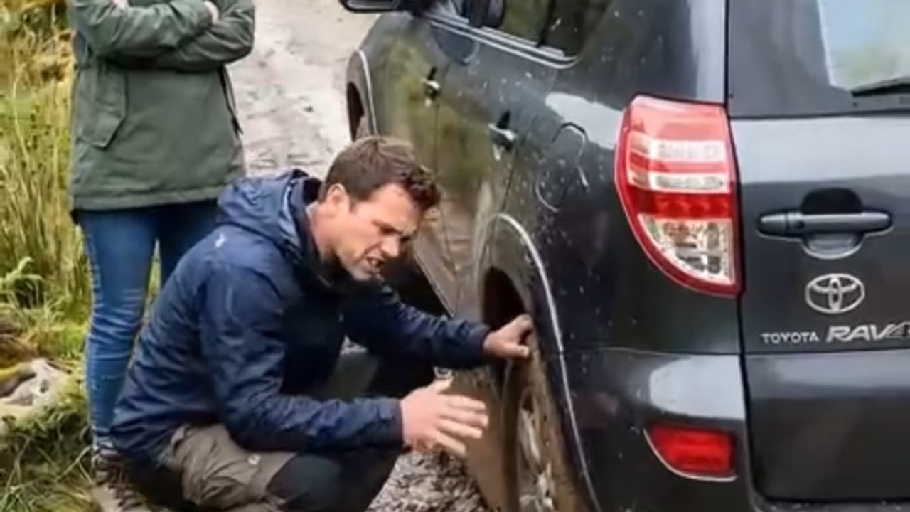 Car Stuck in Wilderness