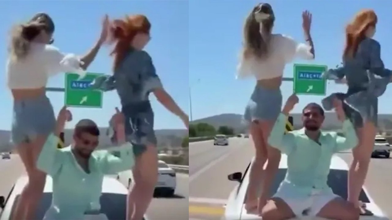 Otoyolun ortasında aracın üstüne çıkıp dans ettiler!