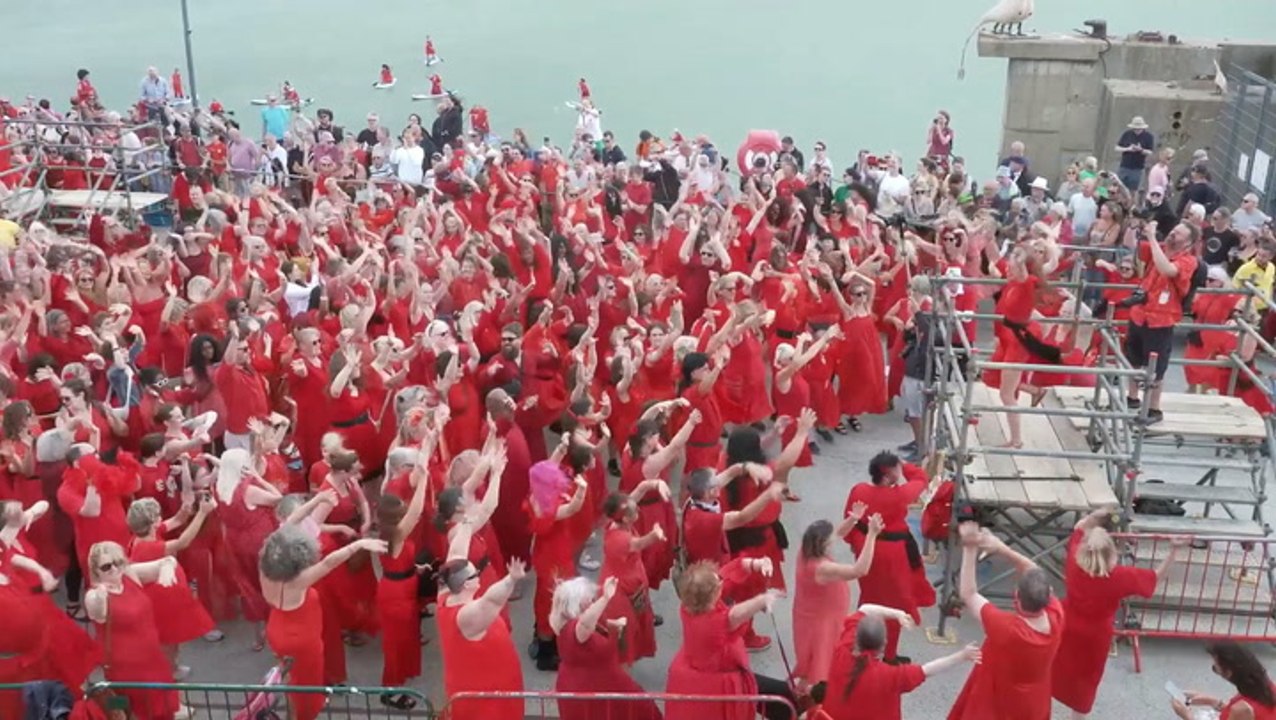 Hundreds of Kate Bush fans don red dresses for iconic Wuthering Heights dance