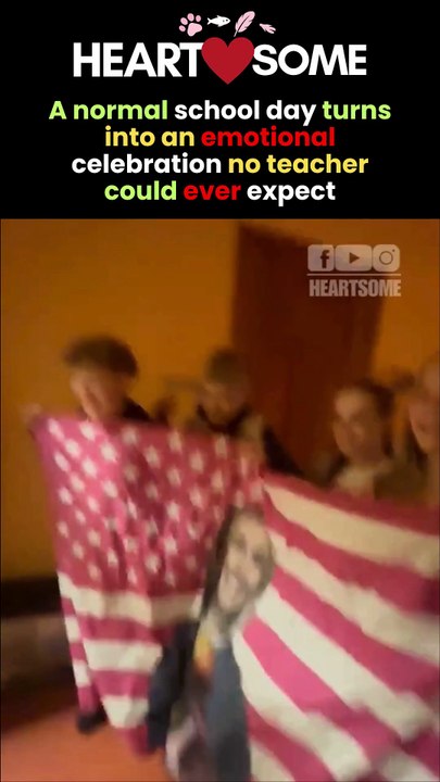 The teacher has a heartwarming moment when her students unveil a flag with her face