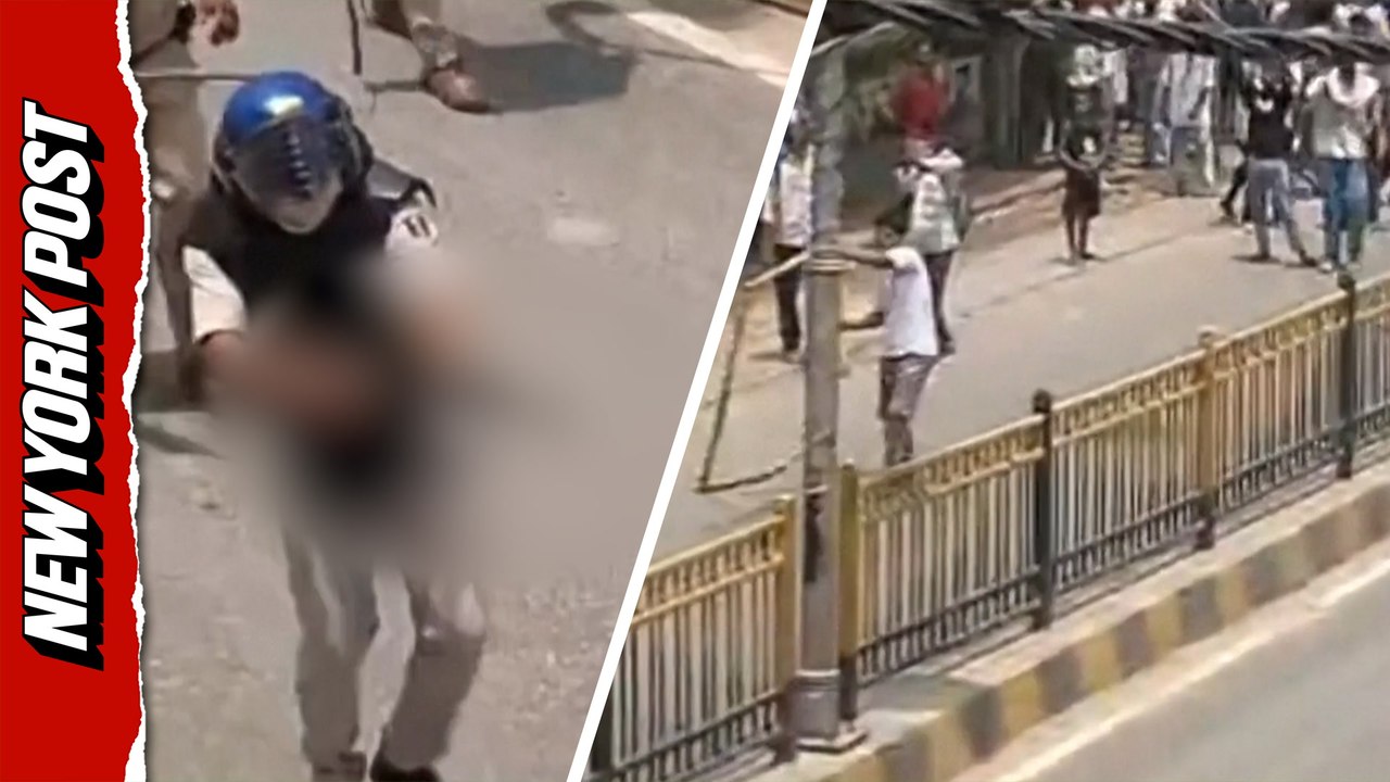 Terrifying Moment Cop Fires AK-47 as Protesters Flee in India