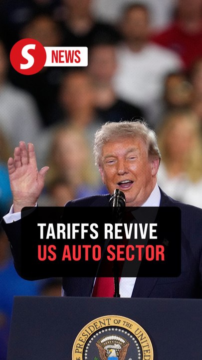 Trump assures allowance of tiny cars, shrugs off hecklers in General Motors visit