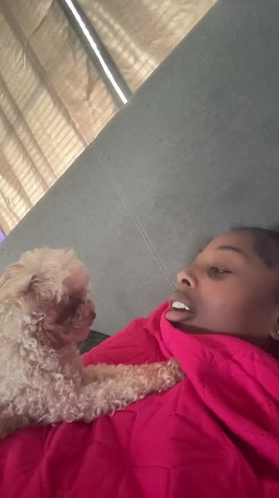 Dog Covers Woman's Mouth With Paw