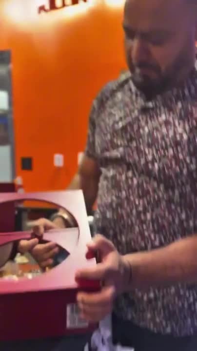 Expensive Alcohol Bottle Falls Out of Case and Breaks