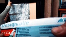 Wifey applying D-C-Fix self adhesive film on our fireplace