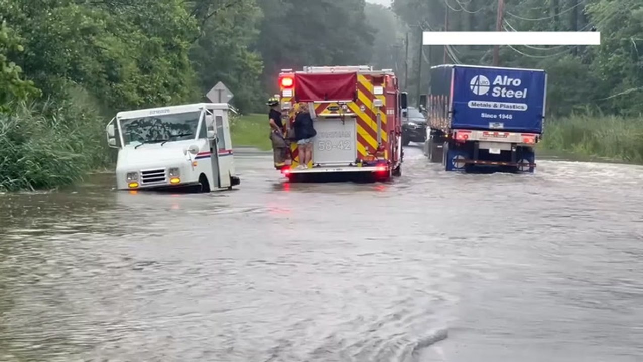 USPS driver rescued after mail van gets stranded in New York floodwaters