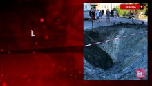 Ukraynalı bir çocuk, ilk adımlarını Kiev'de bir Rus füzesinin oluşturduğu çukurun yakınında atıyor.